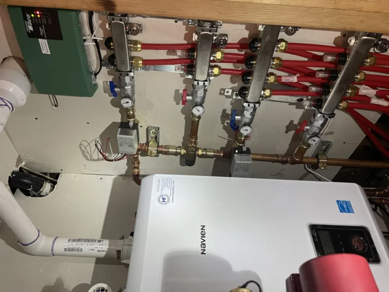 Navien boiler with Uponor radiant manifolds and Taco zone controller installed by Hydroflow for Eichler radiant heating