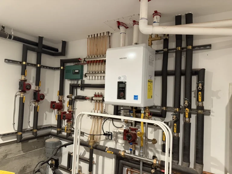Navien NCB combi-boiler installed by Hydroflow with radiant manifolds and circulation pumps in a San Francisco home