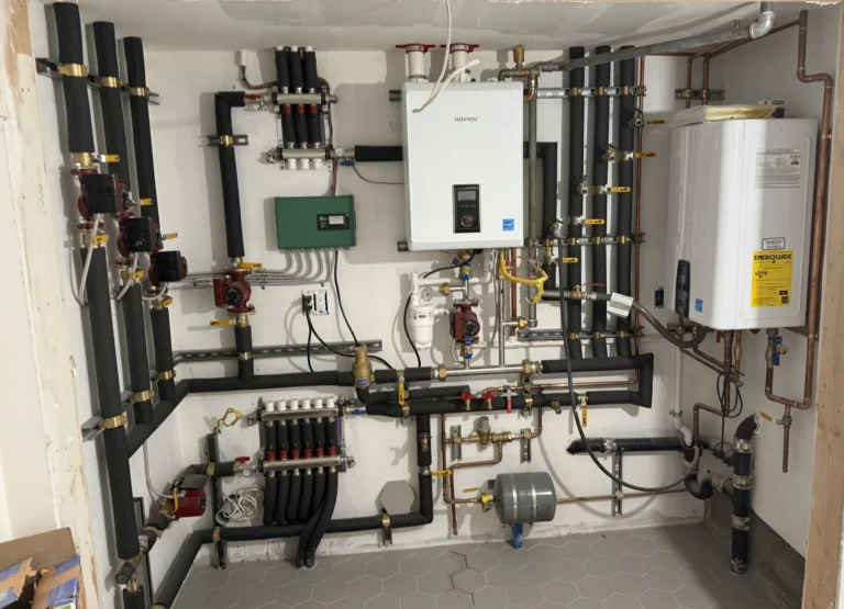 Complete mechanical room with Navien boiler and tankless water heater installed by Hydroflow in San Francisco